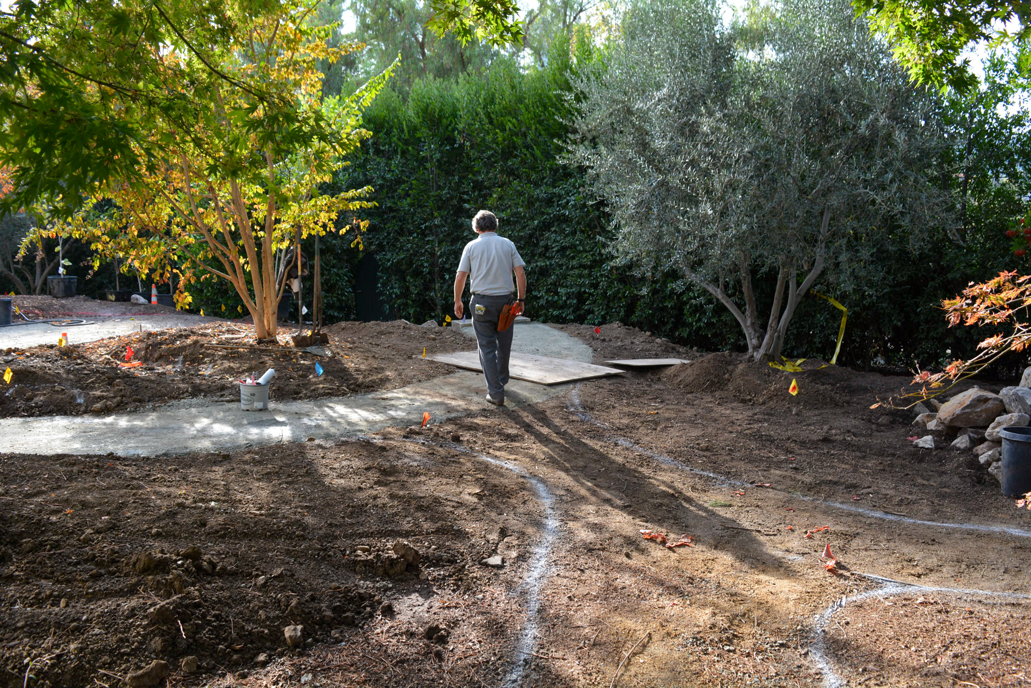 Paths are layed out using spaypaint on the ground before the meadow installation.